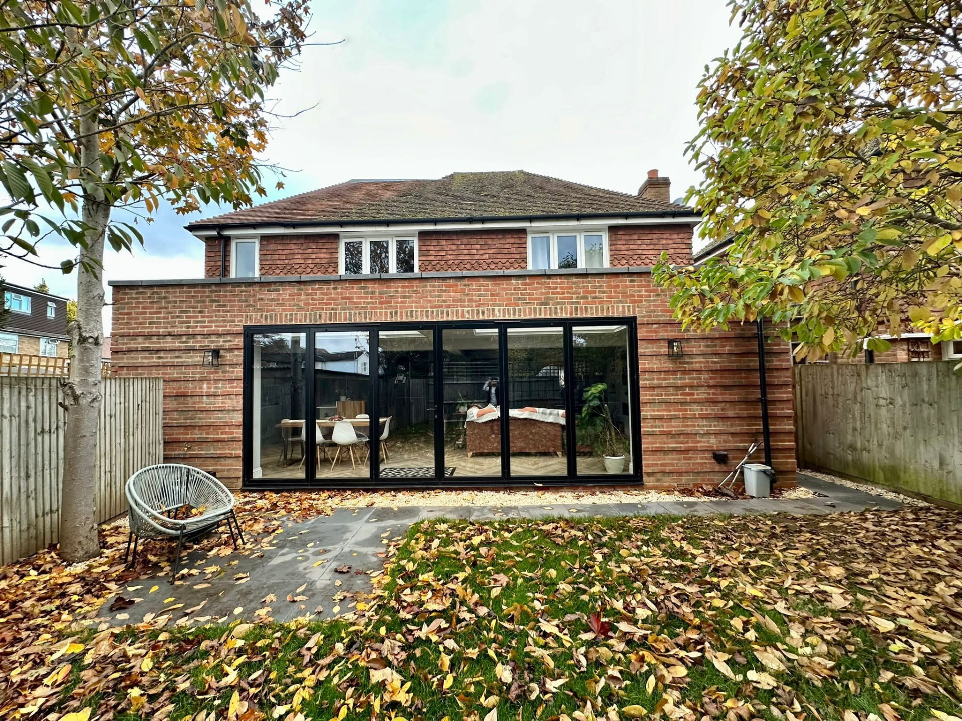 Brick rear extension exterior with large black-framed bi-fold doors