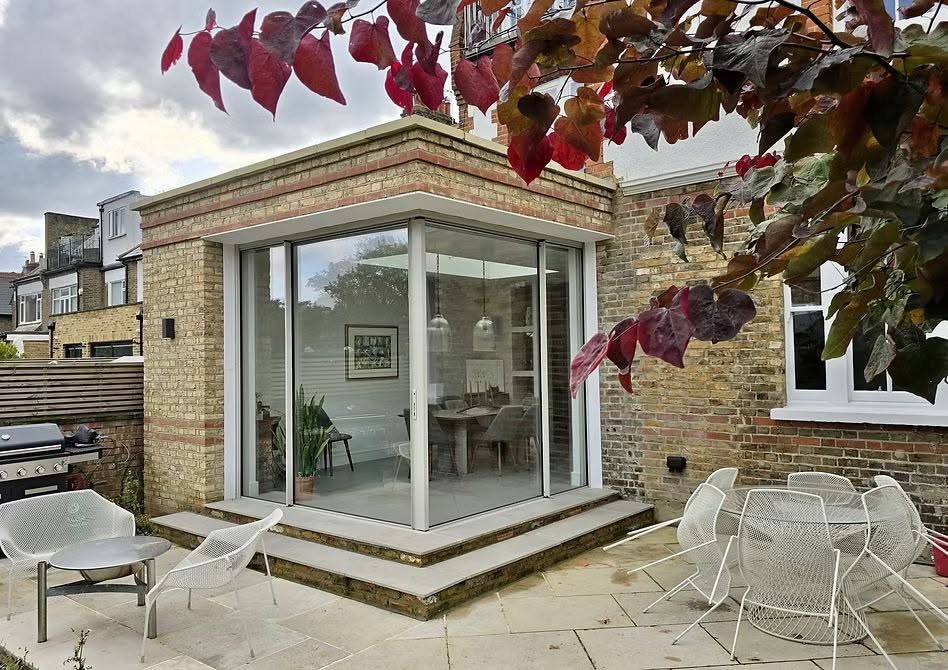 Exterior of a modern glazed rear extension on a brick house