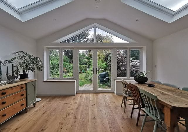 Refurbished garden room with vaulted ceiling, rooflights, gable glazing and oak flooring