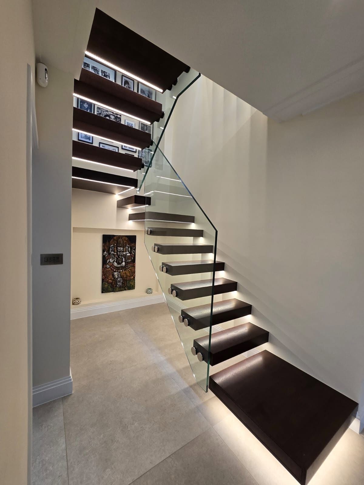 Floating staircase with integrated LED step lighting built by SMART Developments