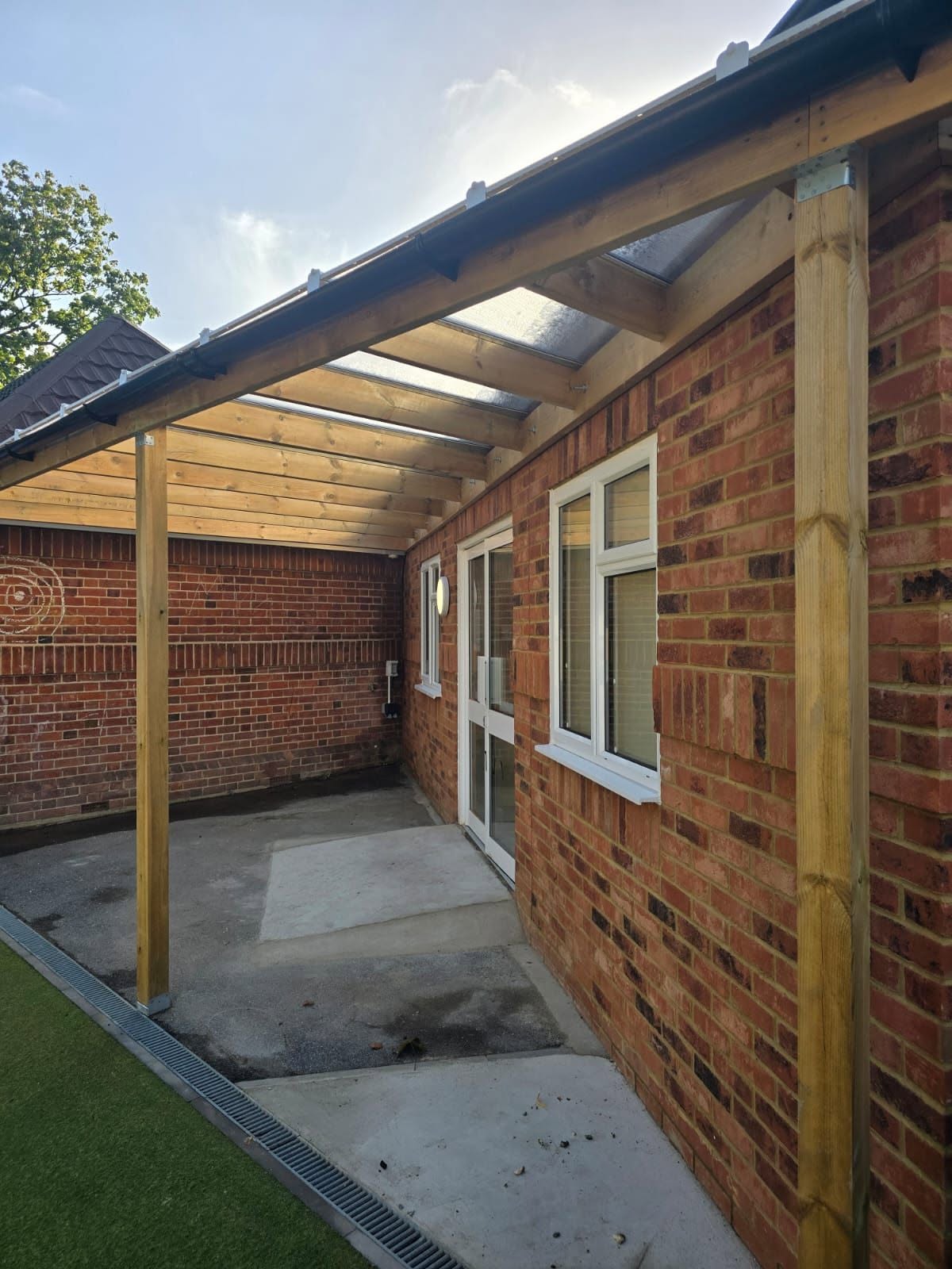 Side view of a timber canopy structure built during a commercial refurbishment project